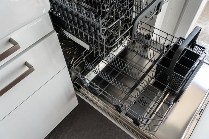 Open stainless steel dishwasher