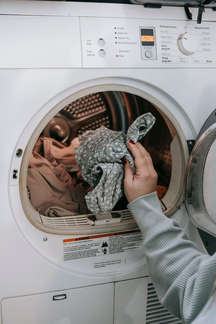 Washing machine being loaded